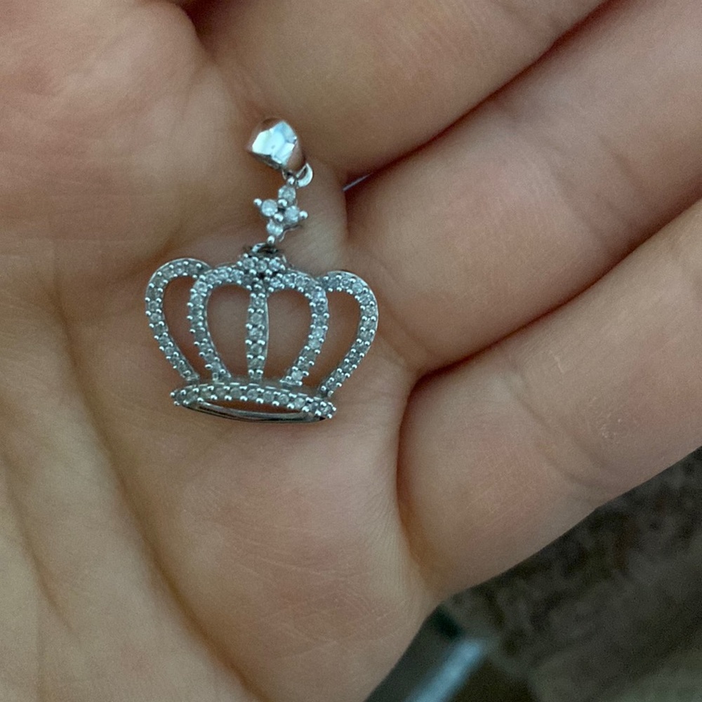 Silver and diamond cross necklace.